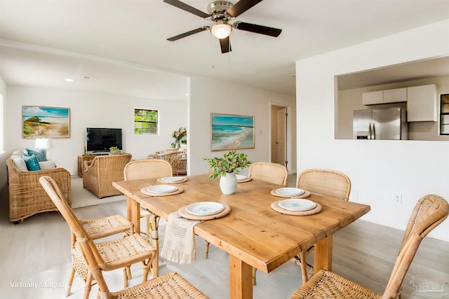 8123 Mobile Hwy, Pensacola, FL 32526 - dining space featuring light wood-style flooring and a ceiling fan