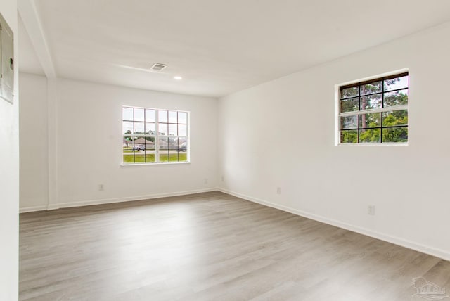 8123 Mobile Hwy, Pensacola, FL 32526 - spare room featuring wood finished floors, baseboards, and recessed lighting