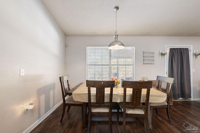 dining space with dark hardwood / wood-style flooring