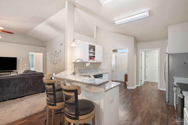 kitchen featuring sink, hanging light fixtures, a kitchen breakfast bar, kitchen peninsula, and white cabinets