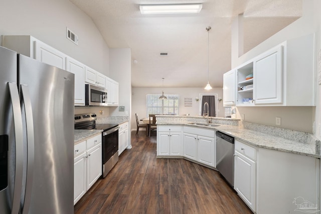 kitchen featuring stainless steel appliances, sink, hanging light fixtures, and white cabinets