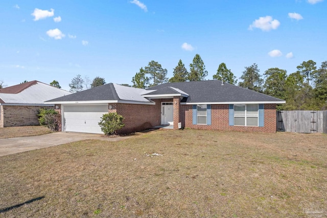 ranch-style home with a garage and a front lawn