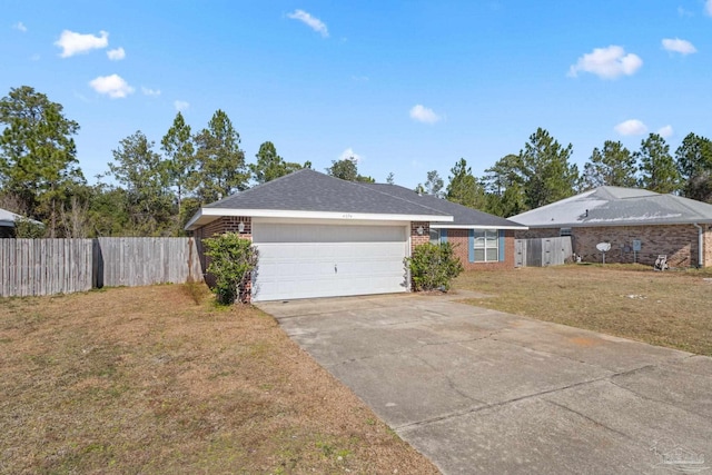 single story home with a garage and a front lawn