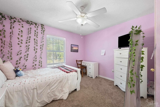 carpeted bedroom featuring a textured ceiling and ceiling fan