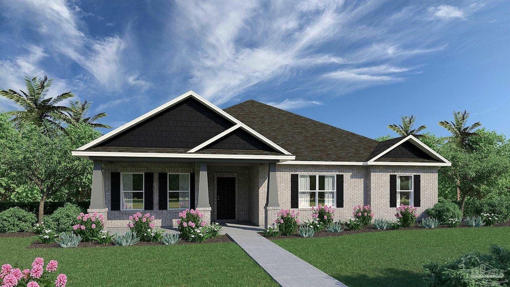 craftsman house with covered porch and a front lawn