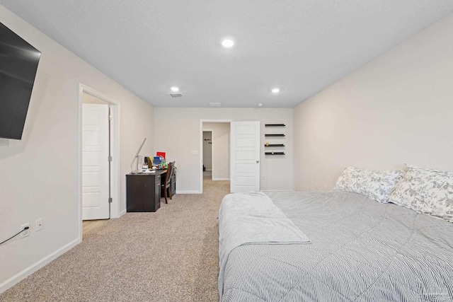 bedroom featuring light carpet