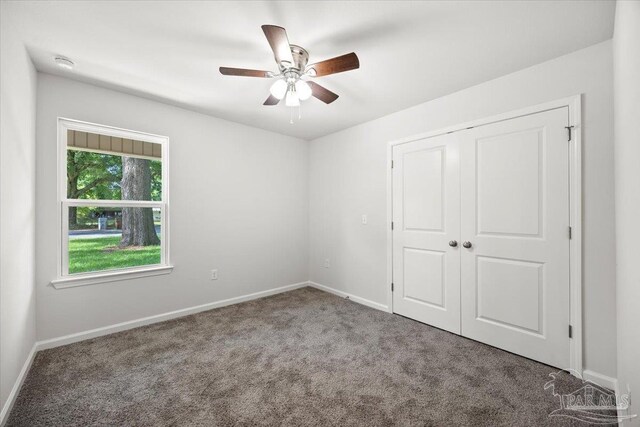 5621 Kingery Rd, Milton, FL 32583 - unfurnished bedroom featuring carpet, baseboards, and a closet