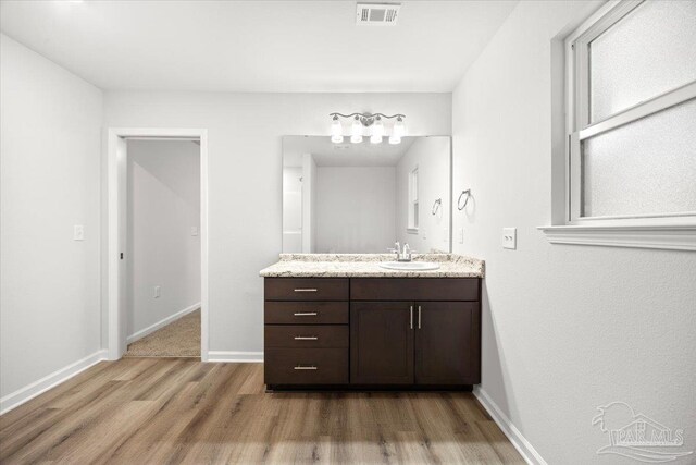 5621 Kingery Rd, Milton, FL 32583 - bathroom featuring wood finished floors, vanity, and baseboards