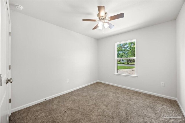 5621 Kingery Rd, Milton, FL 32583 - empty room featuring carpet, ceiling fan, and baseboards