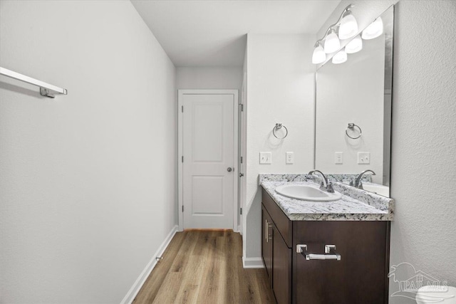 5621 Kingery Rd, Milton, FL 32583 - bathroom featuring wood finished floors, vanity, and baseboards