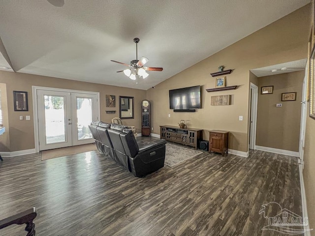 living room with ceiling fan, french doors, dark wood-type flooring, a textured ceiling, and lofted ceiling