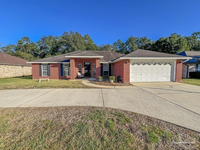 ranch-style home with a garage and a front lawn