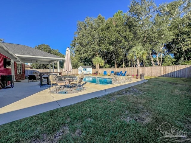 view of patio with a fenced in pool and a storage shed