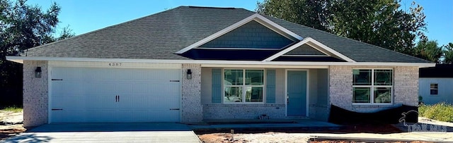 view of front facade featuring covered porch and a garage