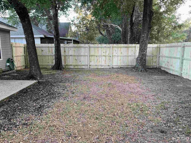 view of yard with a fenced backyard