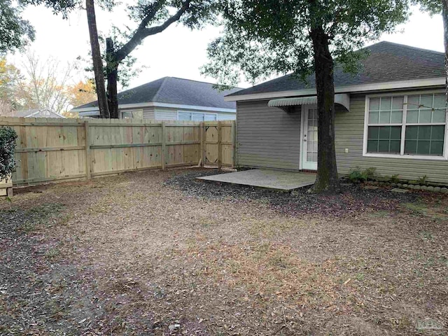 view of yard with a patio area and a fenced backyard