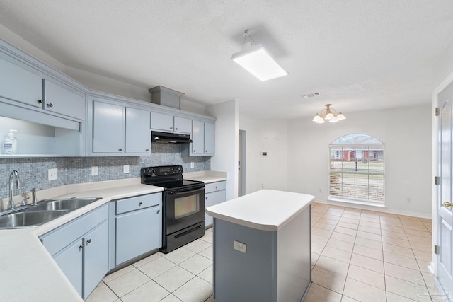 kitchen with a kitchen island, sink, light tile patterned floors, and black range with electric cooktop