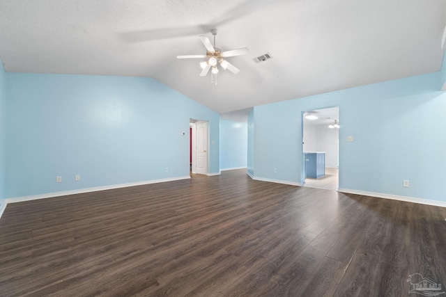 unfurnished living room with vaulted ceiling, dark hardwood / wood-style floors, and ceiling fan