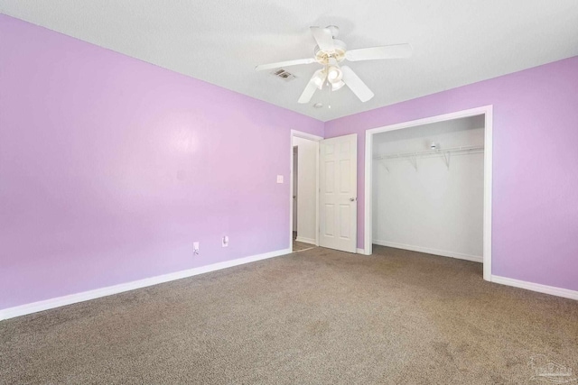 unfurnished bedroom featuring carpet floors, ceiling fan, and a closet