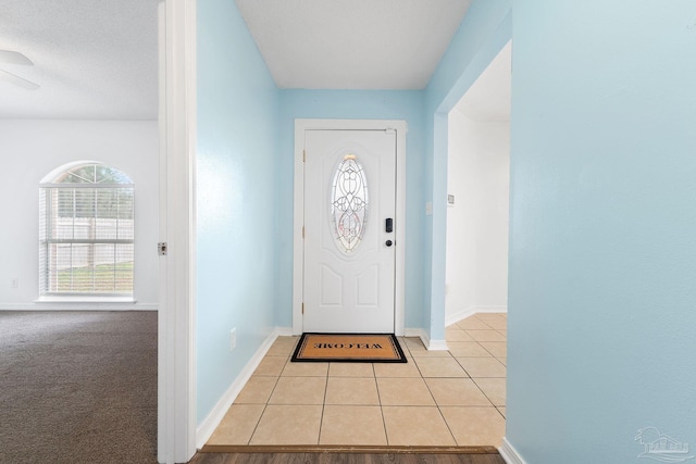 foyer featuring light tile patterned floors