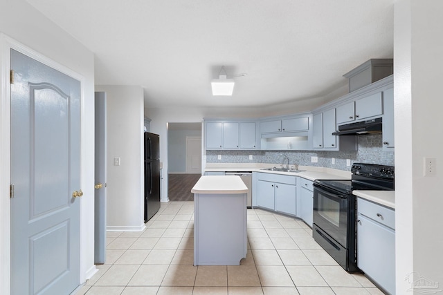 kitchen with sink, backsplash, a center island, light tile patterned floors, and black appliances