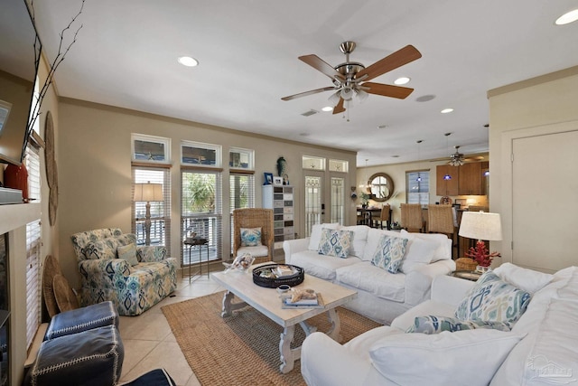 tiled living room featuring a high end fireplace and ornamental molding