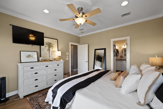 bedroom featuring ceiling fan, crown molding, connected bathroom, and wood-type flooring