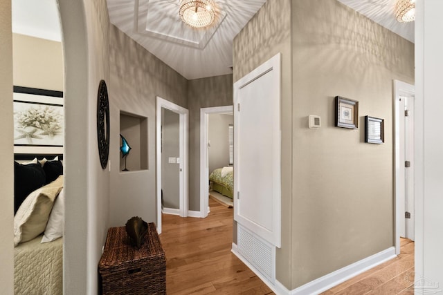 corridor featuring light hardwood / wood-style floors