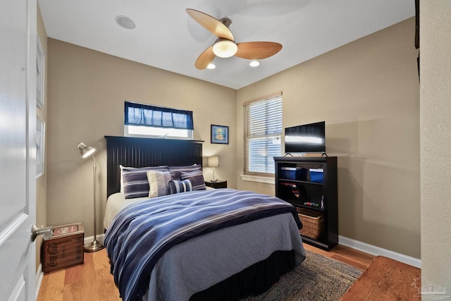 bedroom featuring ceiling fan and hardwood / wood-style floors