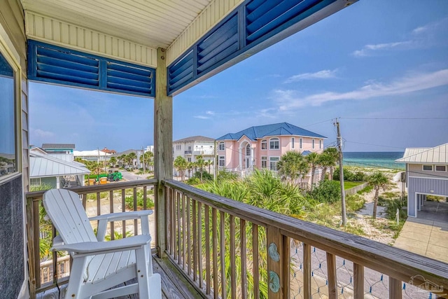 balcony featuring a water view