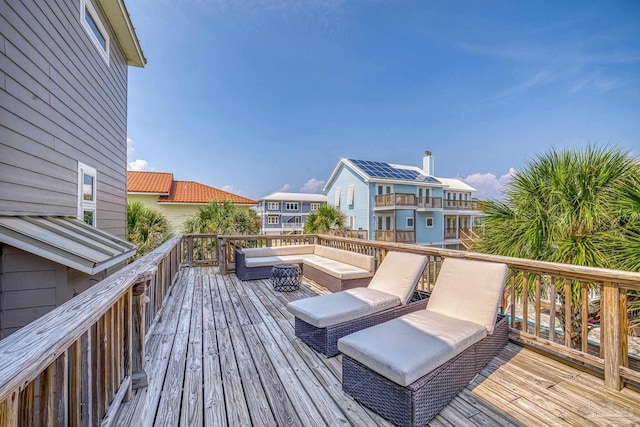 wooden terrace featuring outdoor lounge area