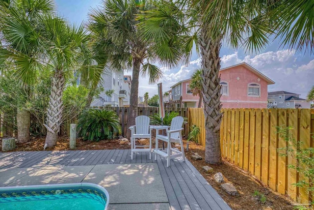 view of swimming pool with a deck