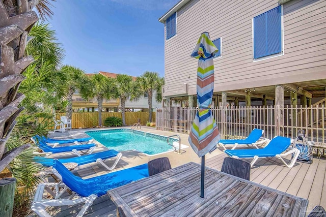 view of pool with a wooden deck