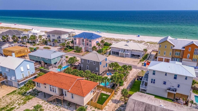 aerial view featuring a water view and a view of the beach