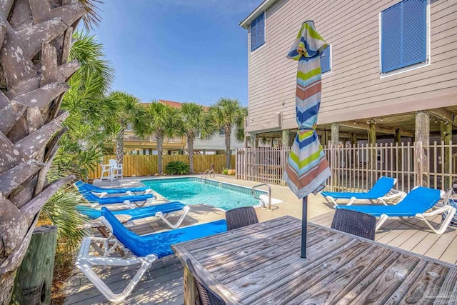 view of swimming pool featuring a wooden deck