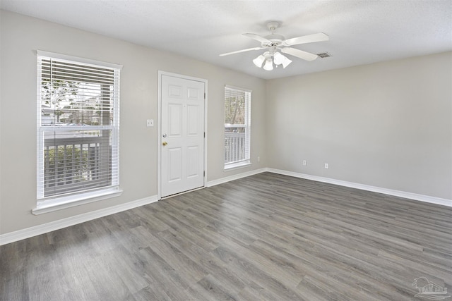 32 Enchanted Way, Santa Rosa Beach, FL 32459 - empty room with wood finished floors, baseboards, and ceiling fan