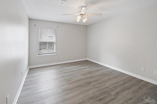 32 Enchanted Way, Santa Rosa Beach, FL 32459 - unfurnished room featuring a ceiling fan, wood finished floors, a textured ceiling, and baseboards