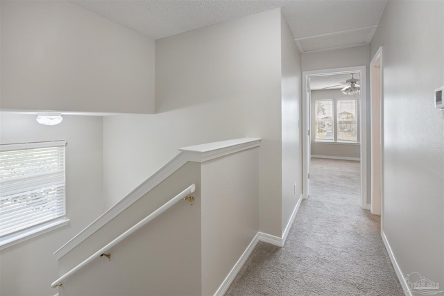 32 Enchanted Way, Santa Rosa Beach, FL 32459 - hallway featuring an upstairs landing, carpet flooring, and baseboards