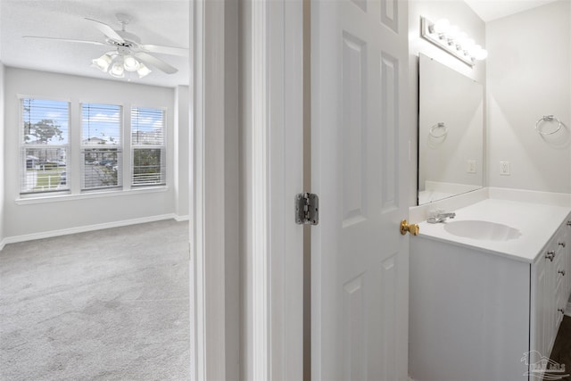 32 Enchanted Way, Santa Rosa Beach, FL 32459 - bathroom with ceiling fan, vanity, and baseboards