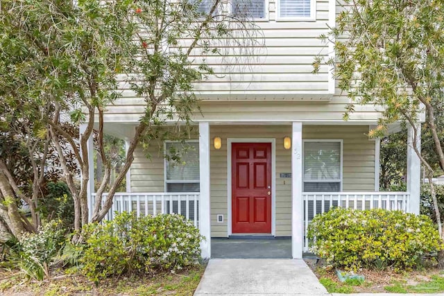 32 Enchanted Way, Santa Rosa Beach, FL 32459 - view of exterior entry with a porch