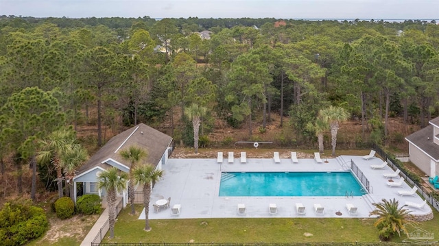 32 Enchanted Way, Santa Rosa Beach, FL 32459 - community pool featuring a view of trees and a patio area