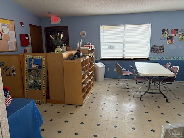 interior space featuring a textured ceiling