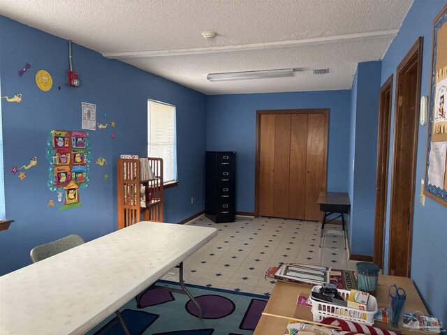 home office featuring a textured ceiling