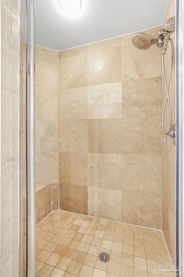 full bathroom with a tile shower