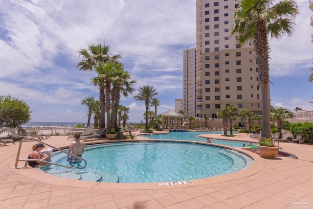 pool featuring a gazebo and a patio