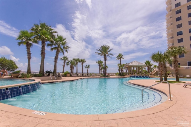 view of swimming pool featuring a gazebo