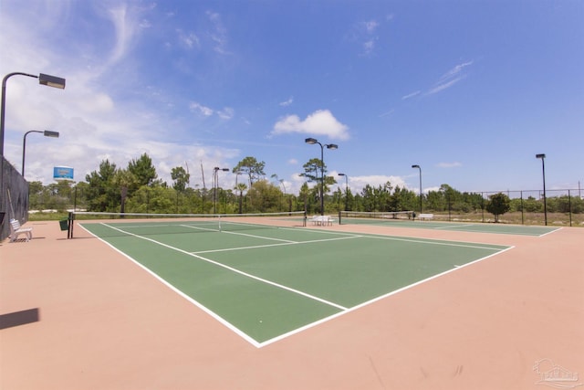 view of sport court with community basketball court and fence