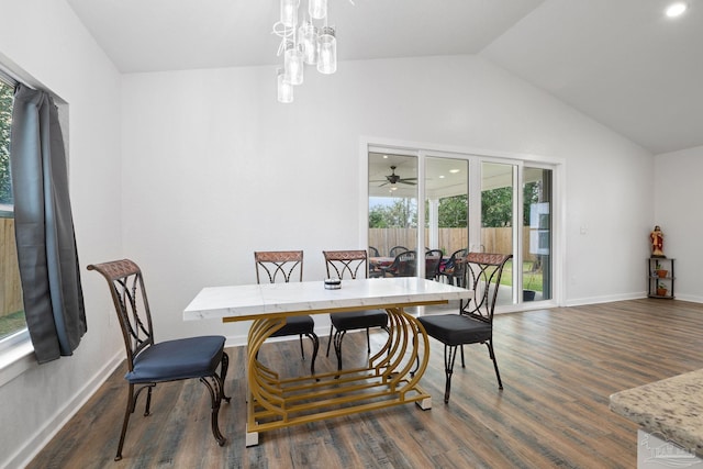 dining area with a notable chandelier, baseboards, lofted ceiling, and dark wood-style flooring