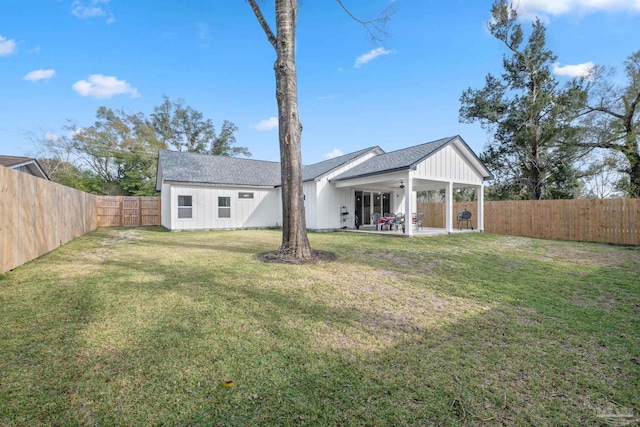 view of yard featuring a patio area and a fenced backyard