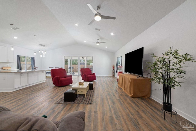 living area with a healthy amount of sunlight, wood finished floors, baseboards, and vaulted ceiling